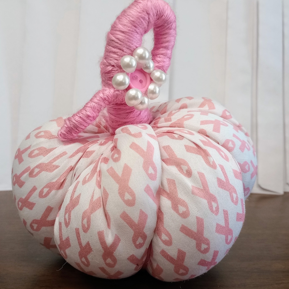 Handmade Breast Cancer Awareness pumpkin. Pink and white.